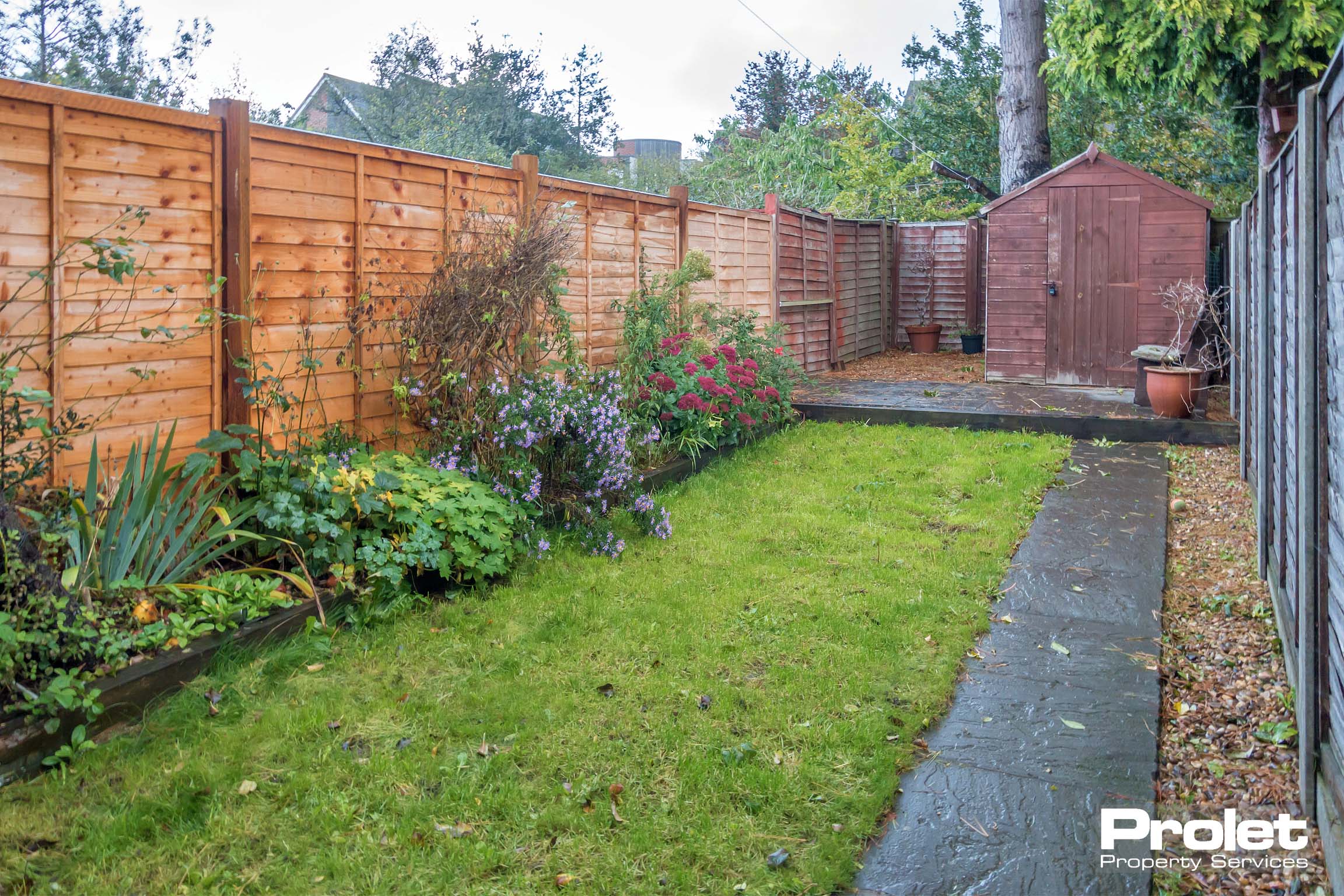 Lawned garden with shed
