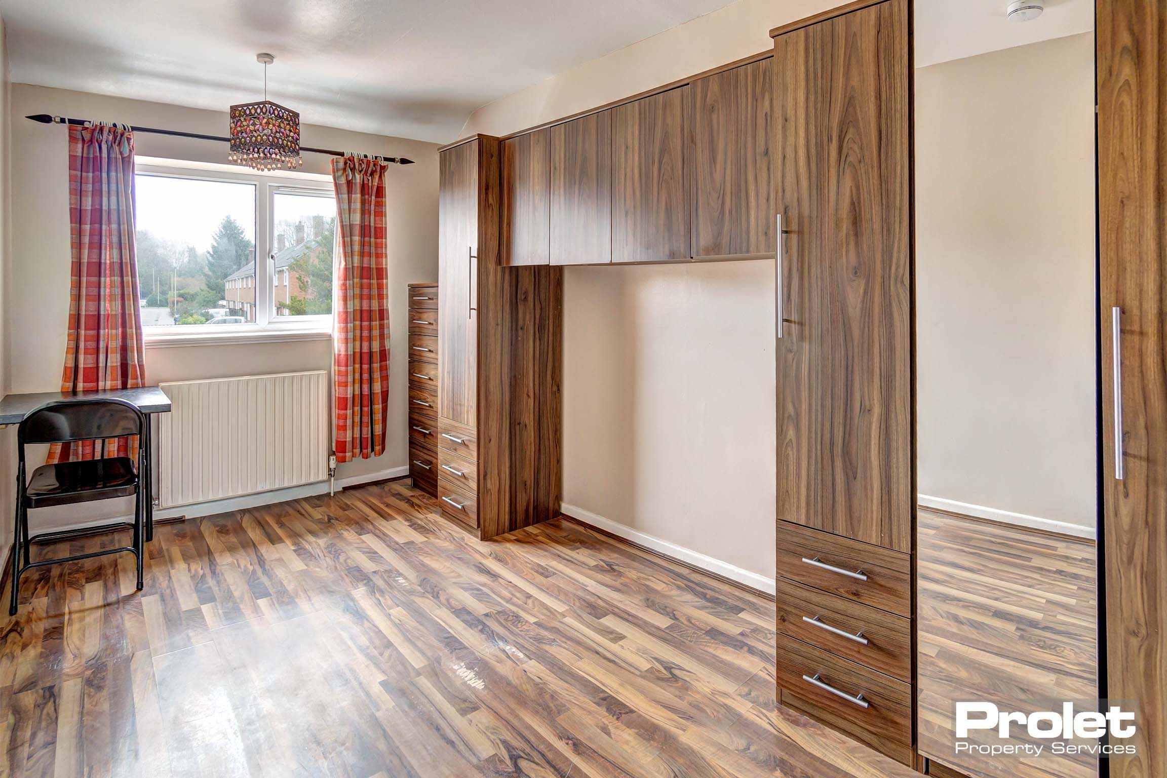 Bedroom with built in storage space