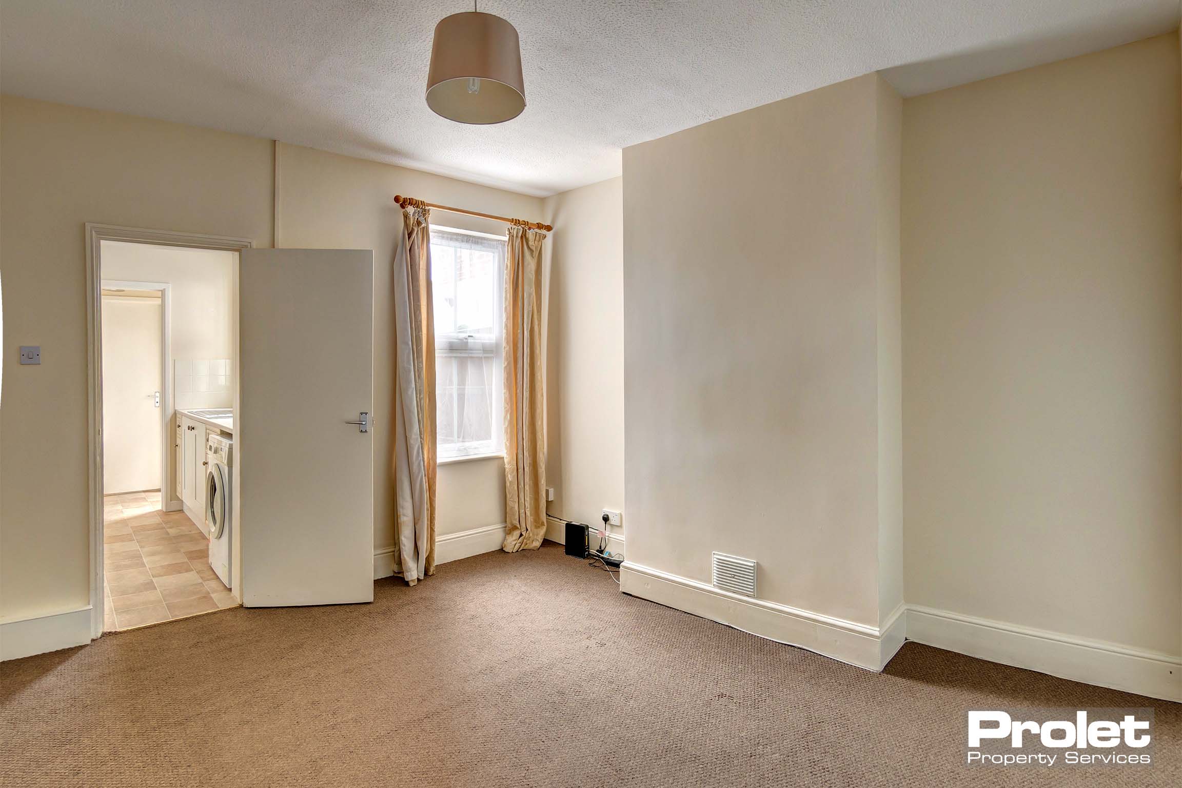 Magnolia walls and brown carpets with neutral shade and curtains