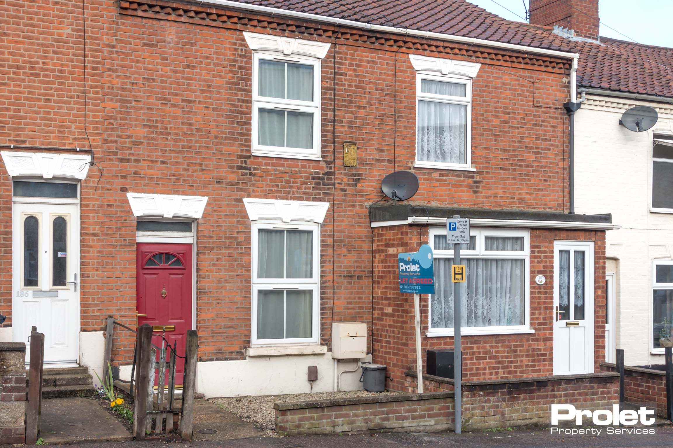 Red brick building with red door