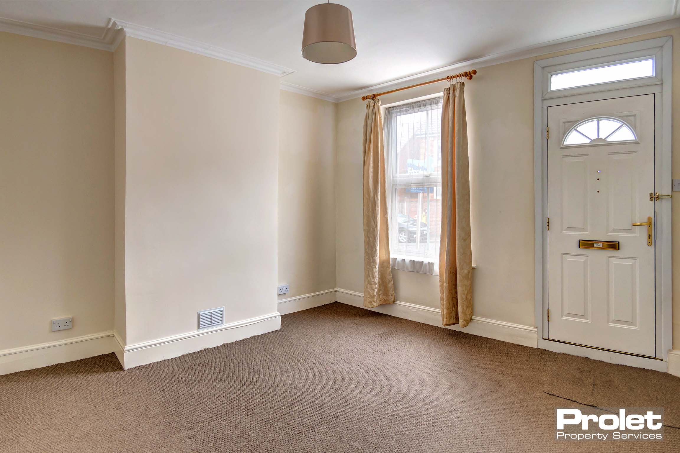 Magnolia walls and brown carpets with neutral shade and curtains