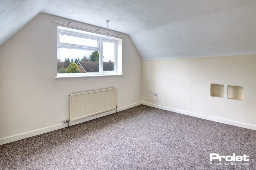 bedroom with magnolia walls and brown carpet