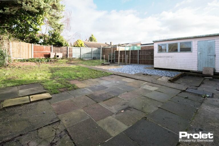 Slabs and lawn to rear garden