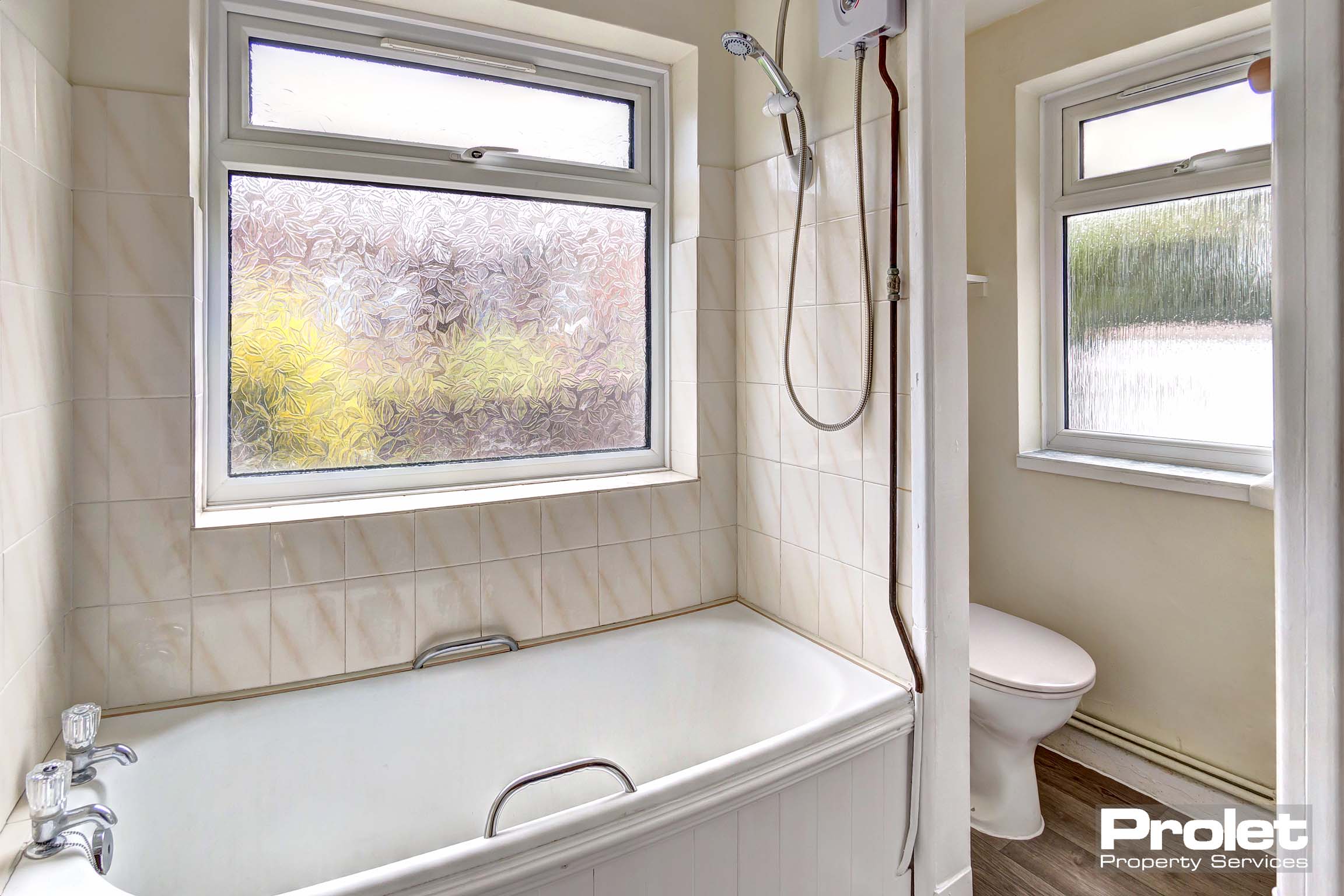 White suite with magnolia walls and separate door to W.C