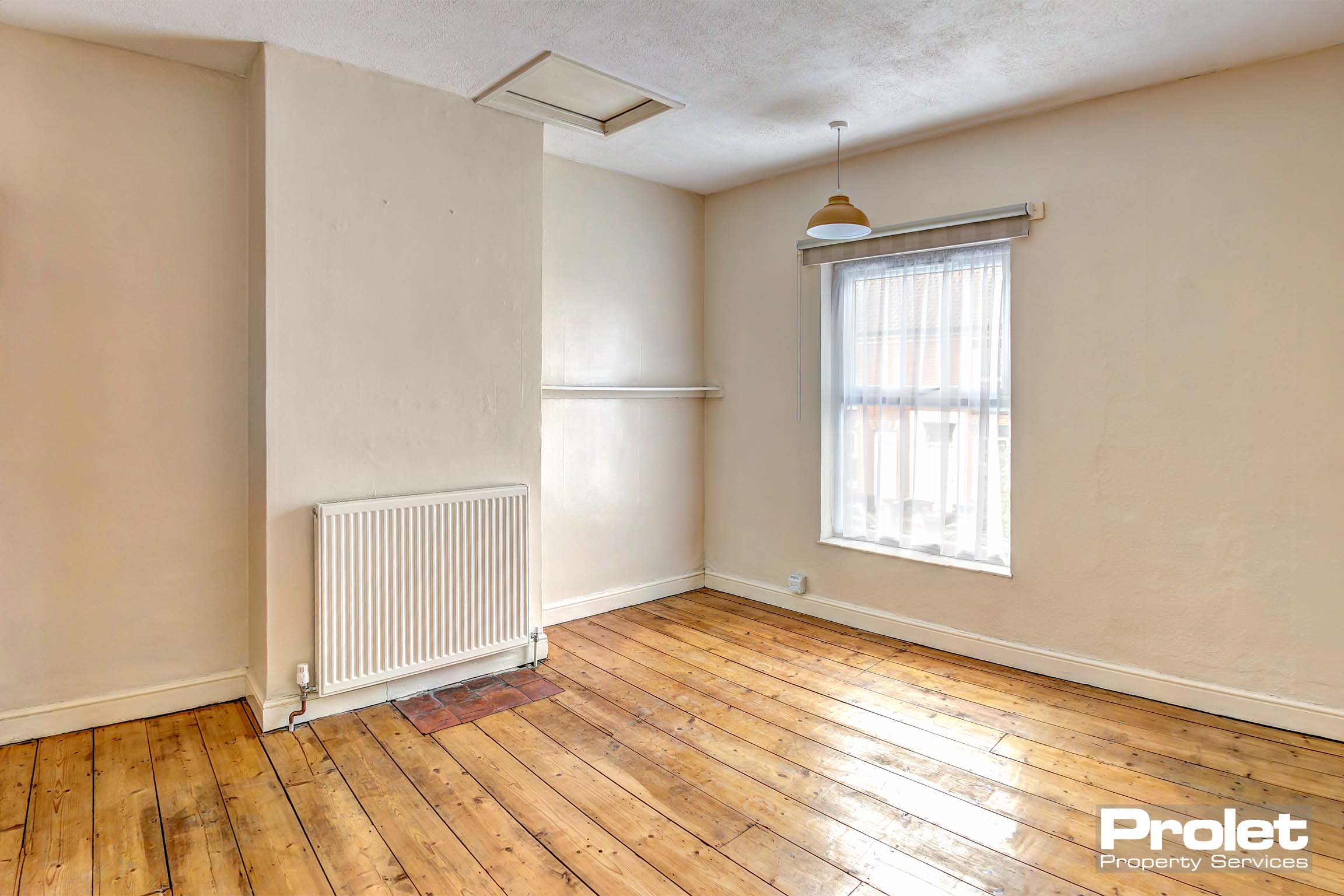 Magnolia walls with stripped floor boards