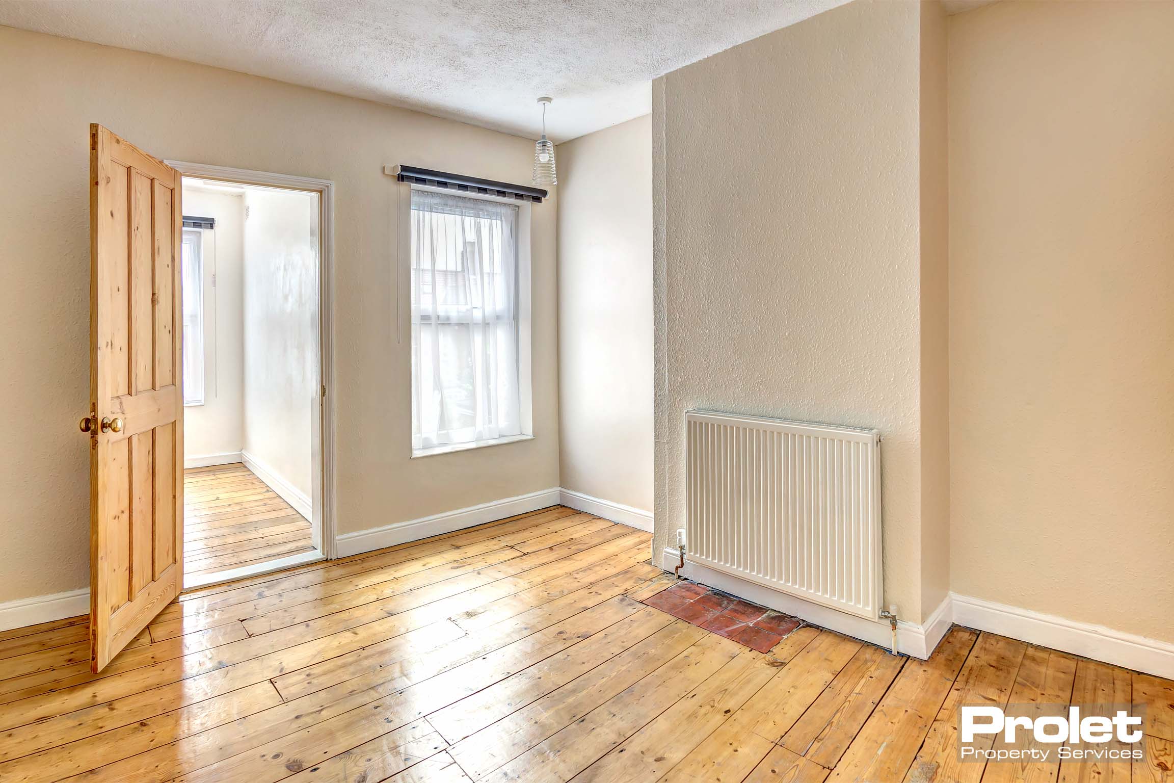 Magnolia walls with stripped floor boards