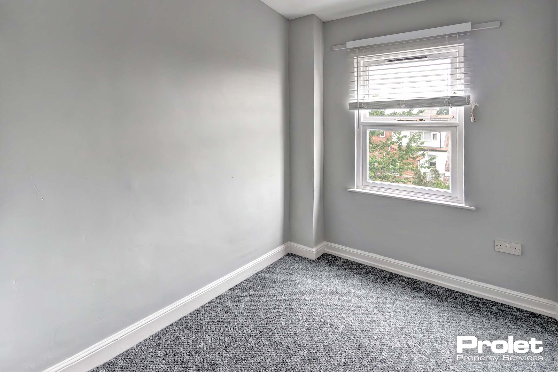 Grey walls and grey carpet