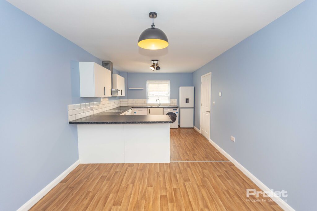 Contemporaty dining area with wood effect flooring