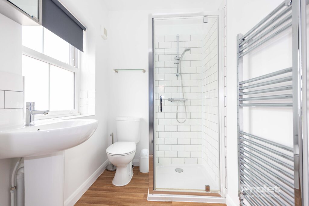 En-suite bathroom, with shower cubicle and sink