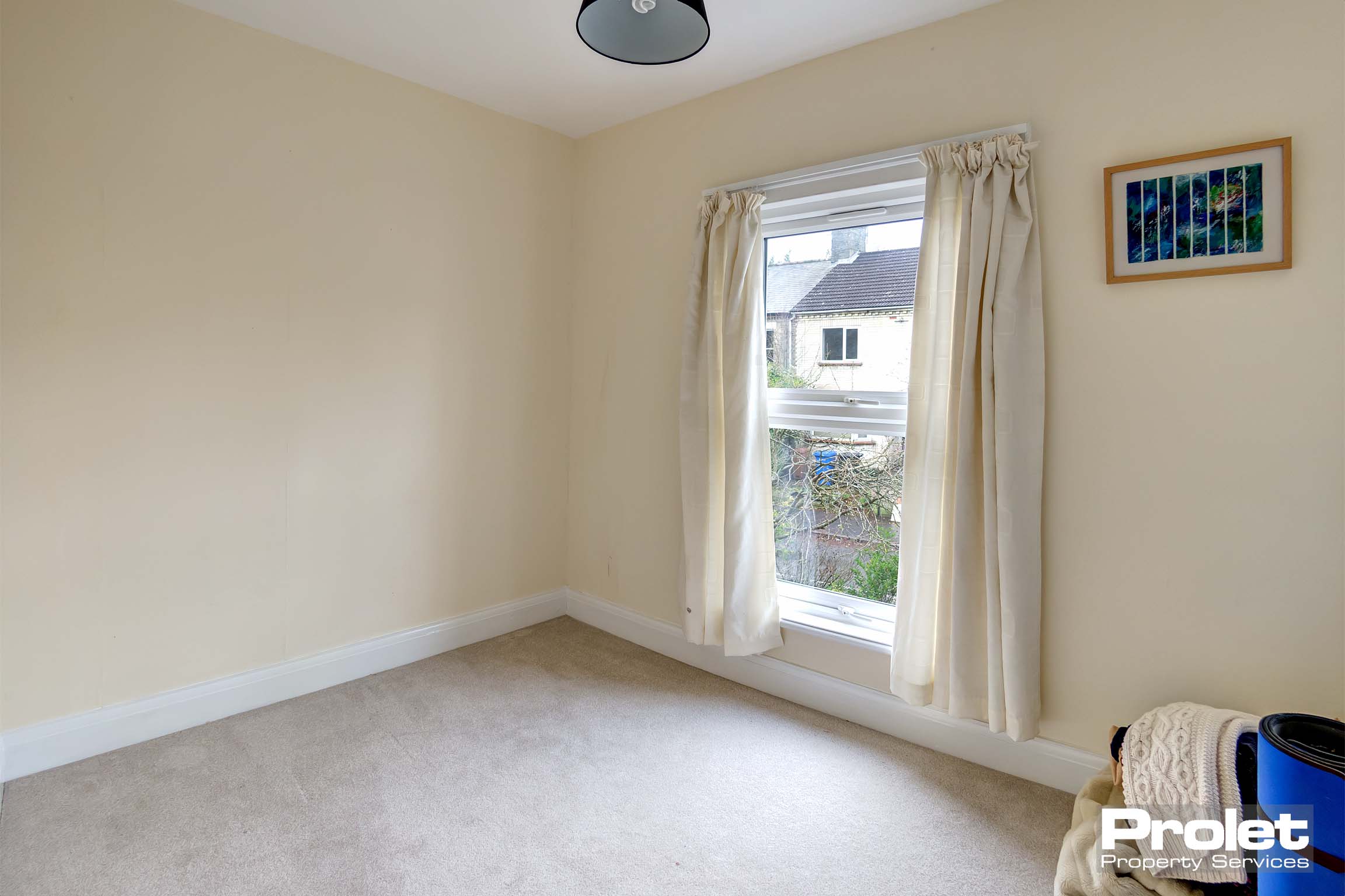 Cream walls with beige carpet