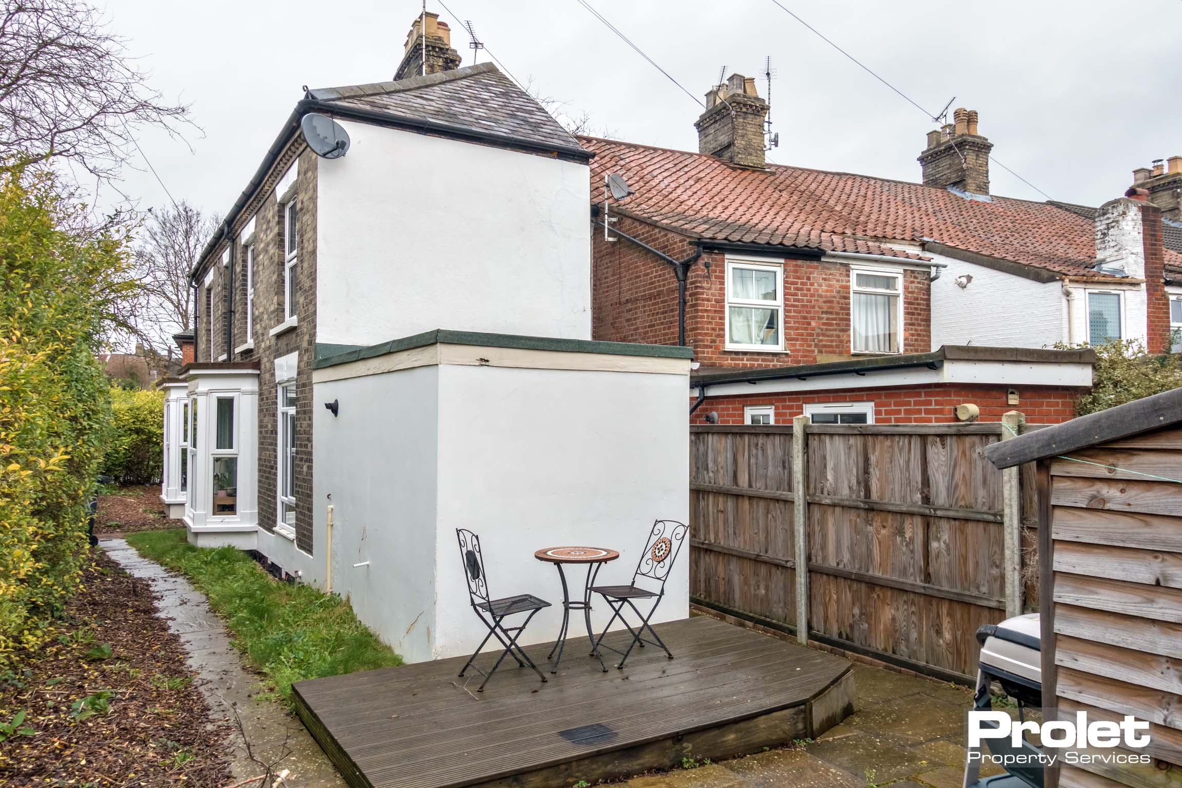 Raised decking area, shed to side and front and rear access to property.