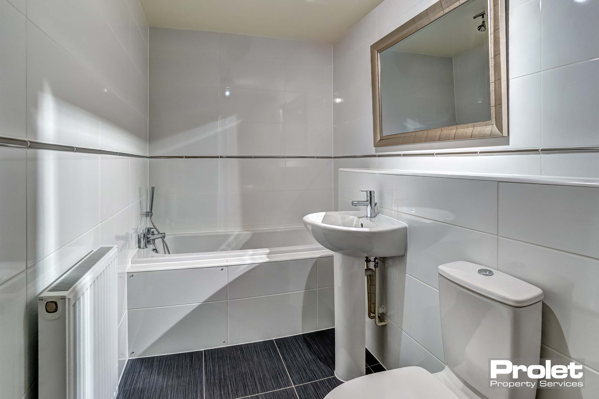 Bathroom with bath, sink, and toilet