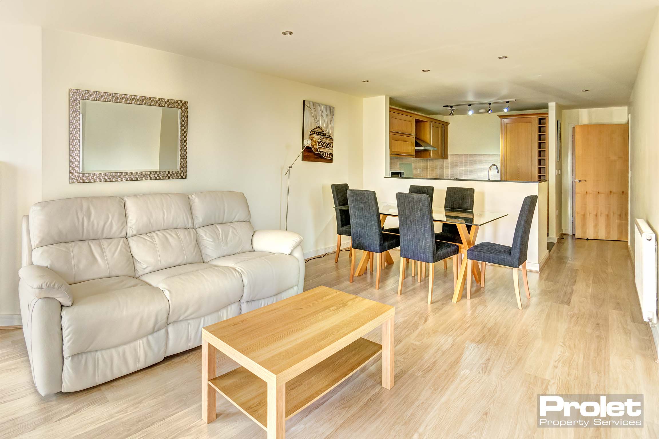 Living room with view of the kitchen and dining area