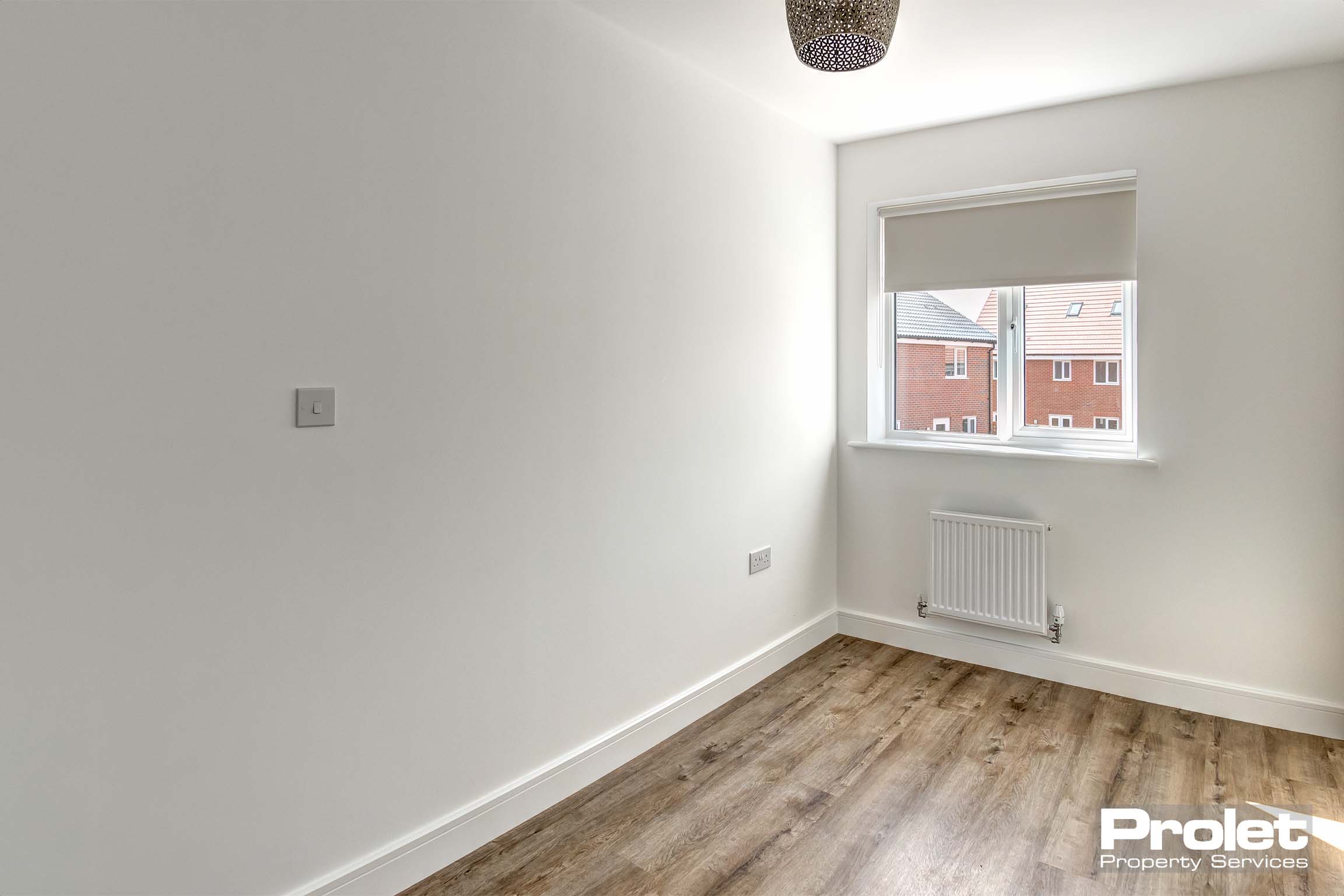 off white walls with laminate flooring