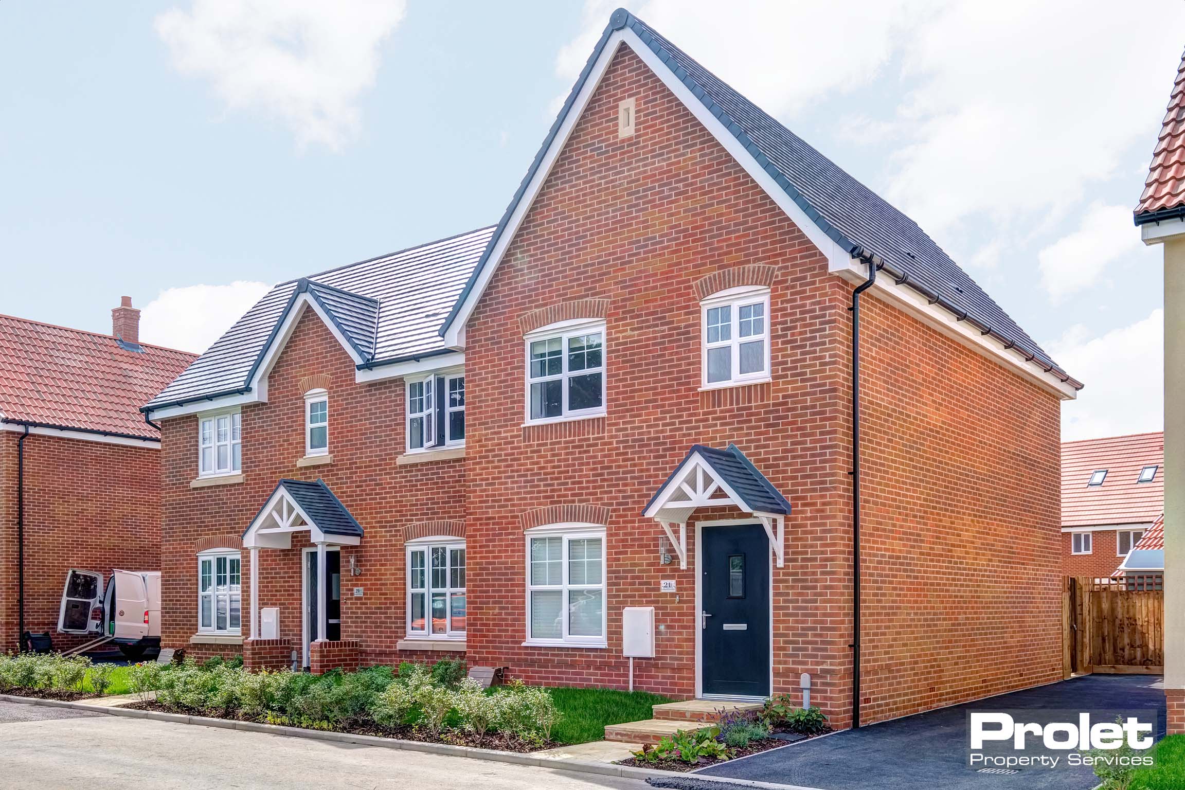 Red brick house with driveway