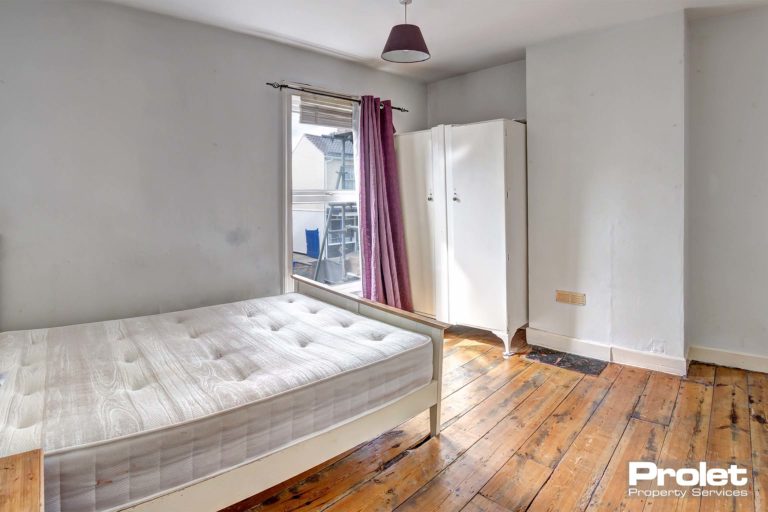 Double bedroom with wooden floors