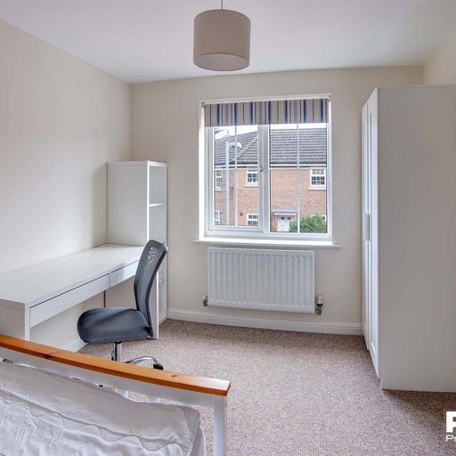 Double bedroom with white furniture