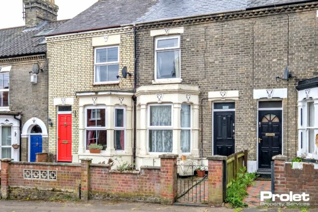 Brick house with small gated front path