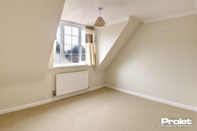 Magnolia walls with cream carpets.