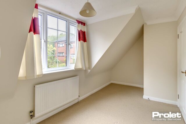 Magnolia walls with cream carpets.