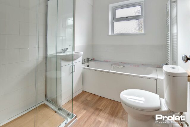 New bathroom suite with separate bath and shower cubicle