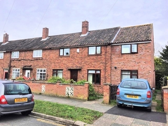 Red brick, end terrace property with driveway