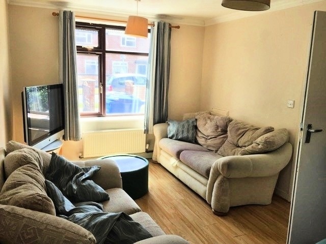 Living room with laminate floor, and two sofas