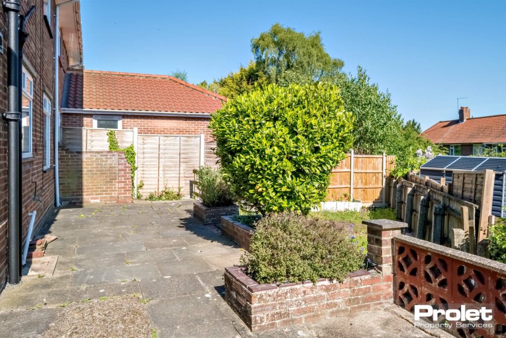 patio arear leading down to lawn