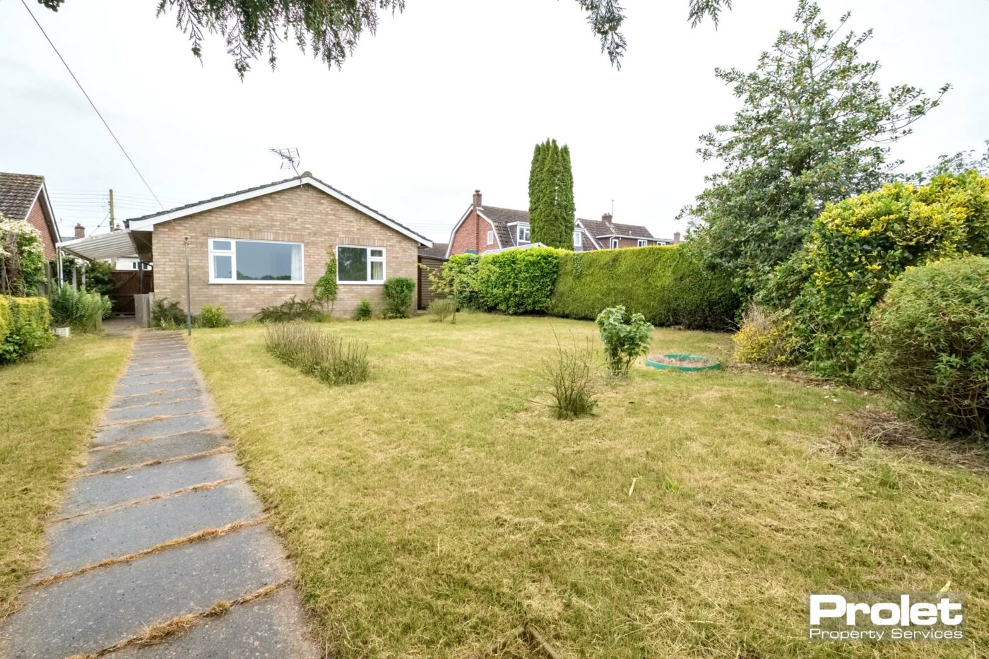 View of property from rear, with garden path, and lawn