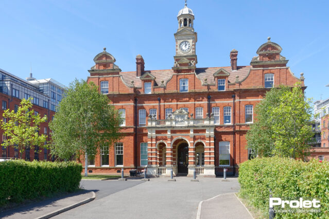 Large brick building with ramp entrance into building