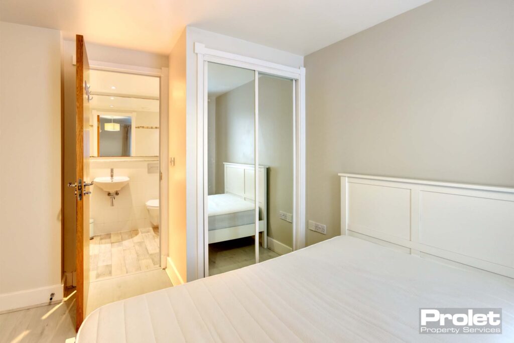 Double bedroom with mirrored built in wardrobe, double bed and ensuite
