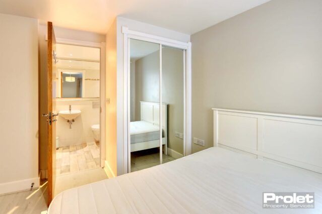 Double bedroom with mirrored built in wardrobe, double bed and ensuite