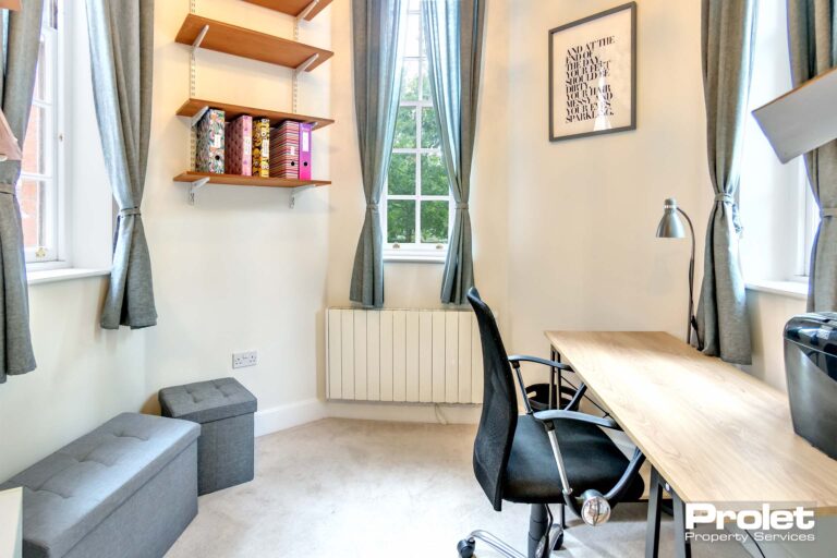 small hexagon shaped study room with desk