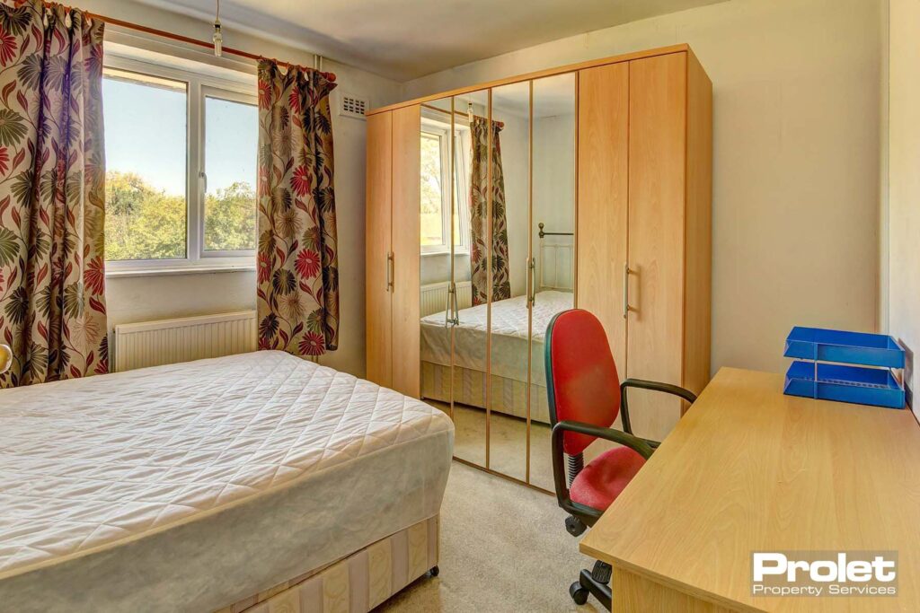 Double bedroom with divan bedframe & mattress, large wardrobe with part mirrored doors, desk, chair and draws