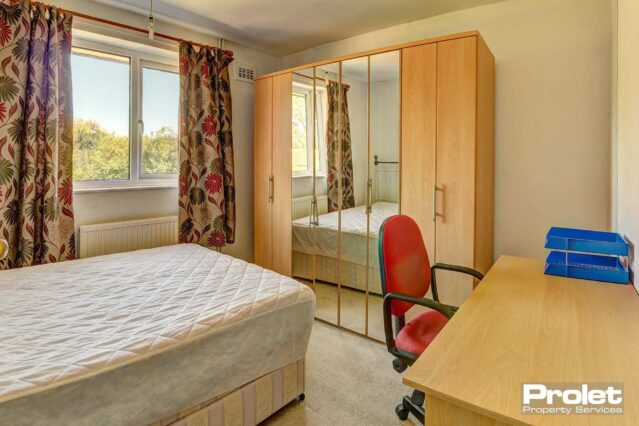 Double bedroom with divan bedframe & mattress, large wardrobe with part mirrored doors, desk, chair and draws