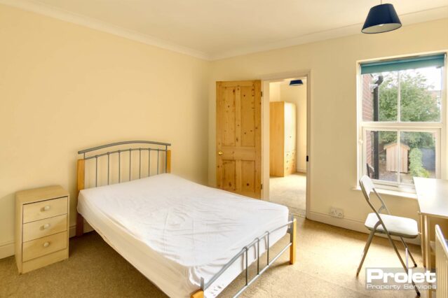 Rear bedroom with box room and double bed