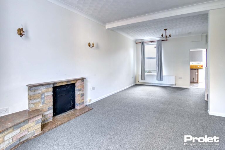 Open plan living/dining room with brick fireplace