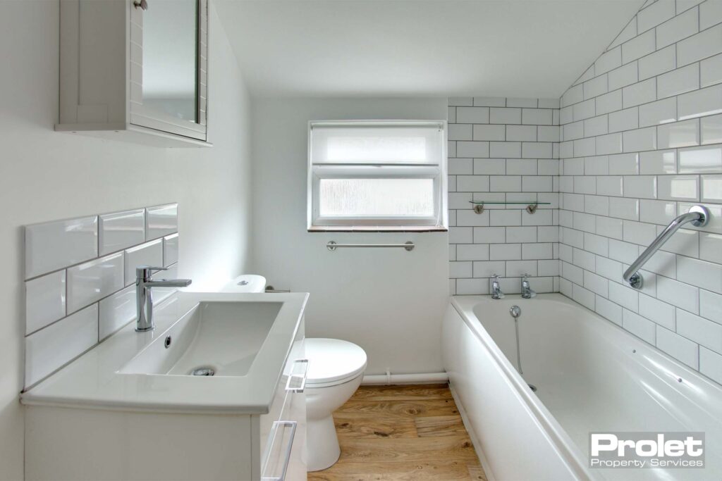 Bathroom with toilet, sink, and bath