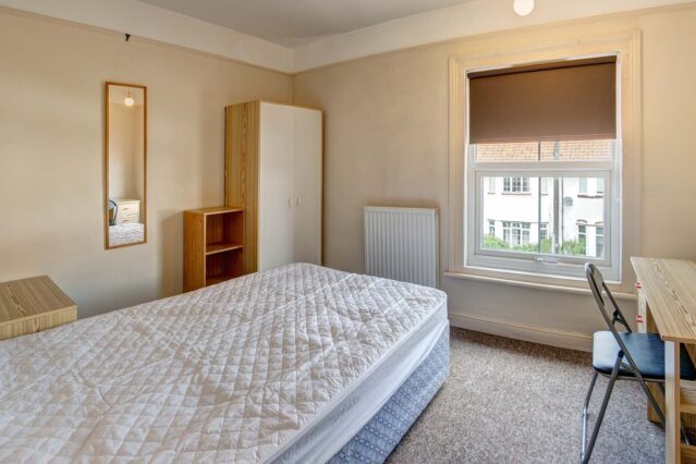 Bedroom with double bed, and wardrobe