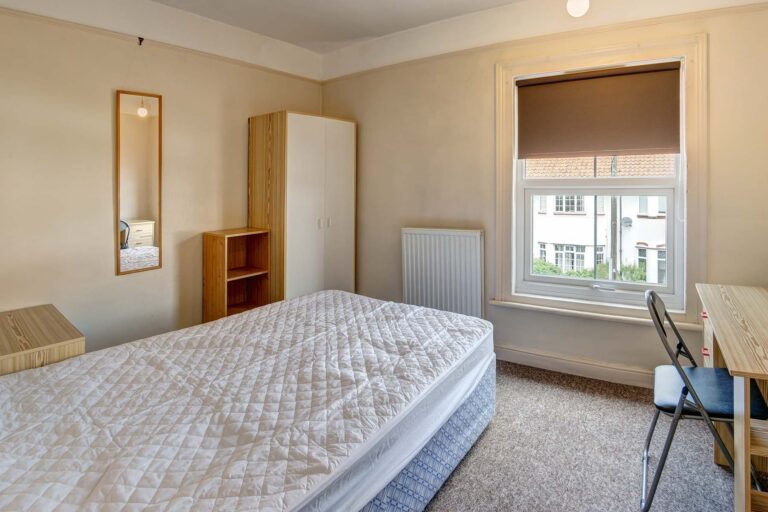 Bedroom with double bed, and wardrobe