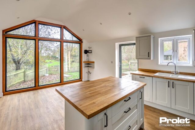 Wooden flooring and kitchen island