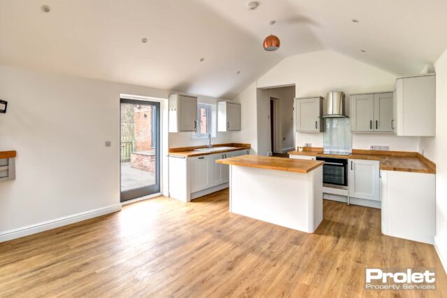 Wooden flooring and kitchen island
