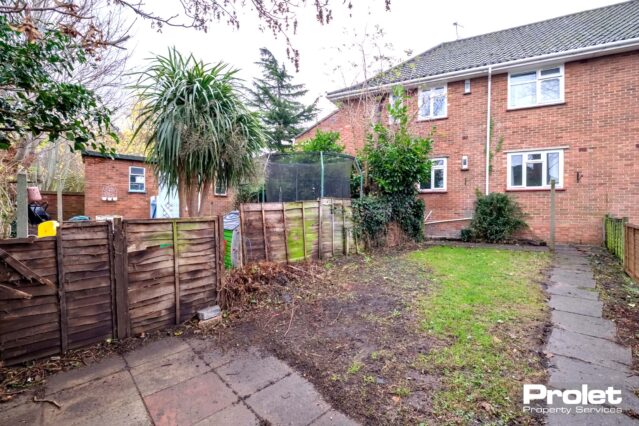 Rear garden with fence to side and rear. Laid lawn and patio area