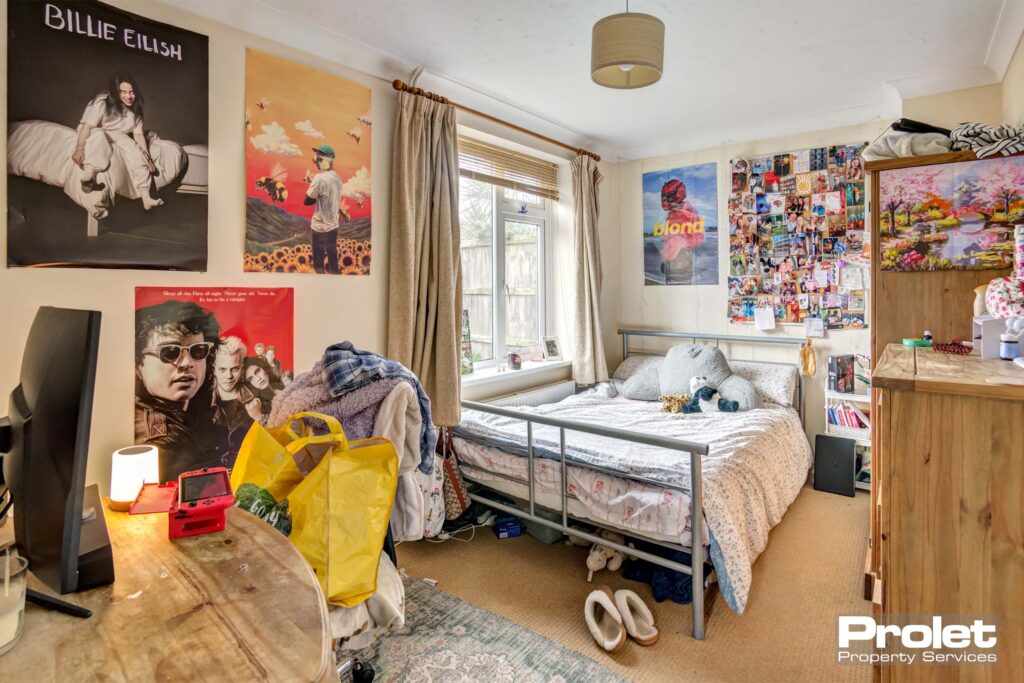 Large bedroom with double bed and desk