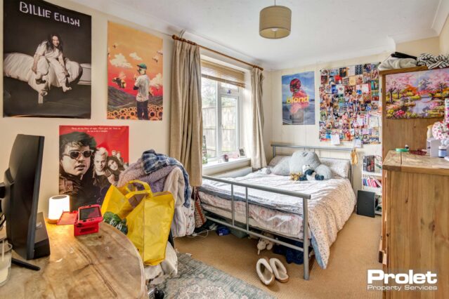 Large bedroom with double bed and desk