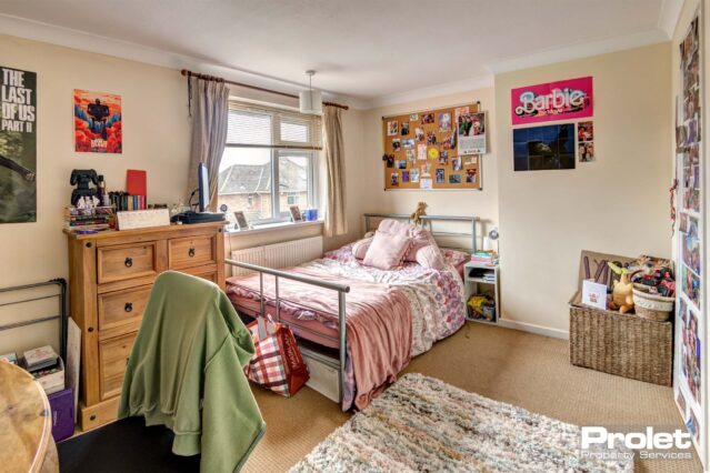 Large bedroom with double bed and desk