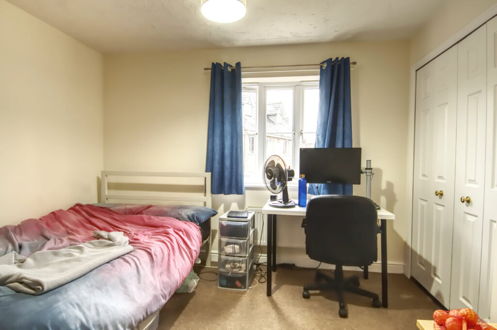 Double bedroom with double bed and desk