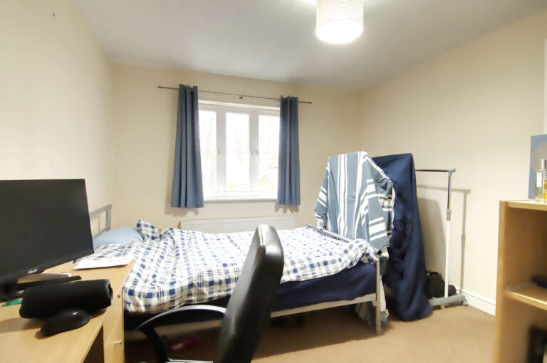 Double bedroom with double bed and desk