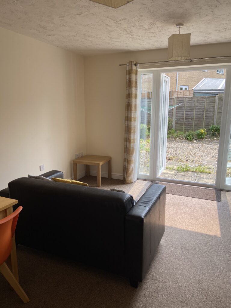 Lounge with glass door to rear garden